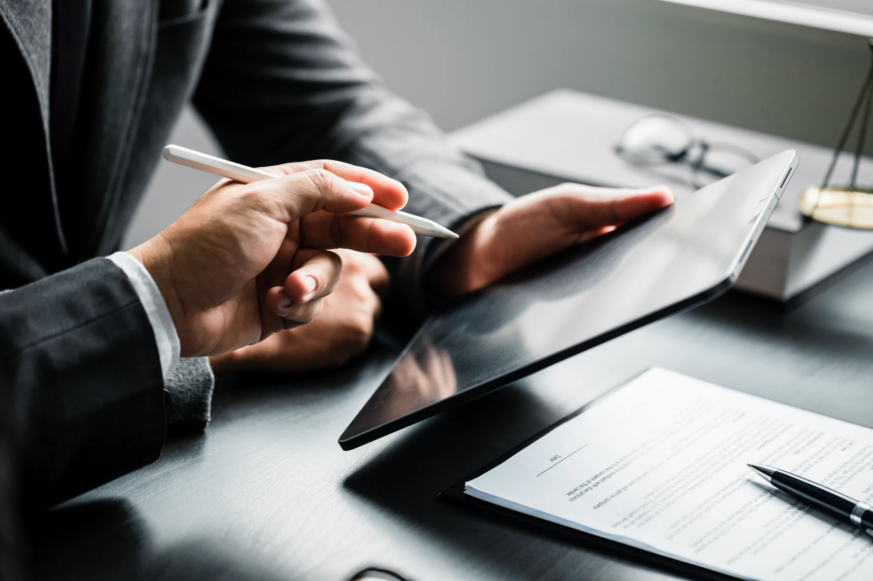 Close up of businessman or lawyers discussing about contract or business agreement at law firm office, business people making deal document legal, law and justice advice service concept.